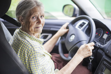 Senior woman driving a car