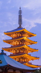 Fototapeta na wymiar Japanese red pagoda in Asakusa temple at twilight