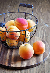 Fresh abricots on wooden background