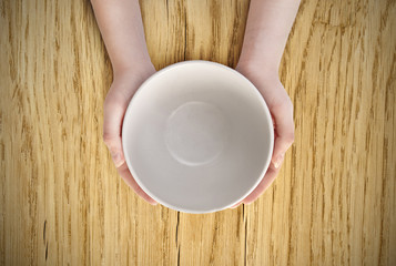Empty plate in hand
