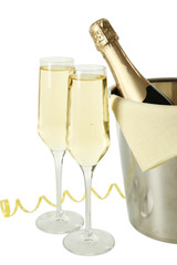 Glasses of champagne with bottle in a bucket on white background