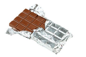 Fototapeta na wymiar Milk chocolate bar in foil isolated on white