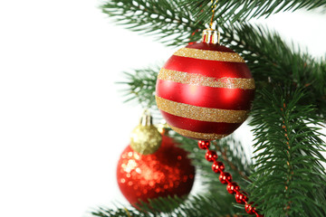 Christmas baubles on christmas tree on white background
