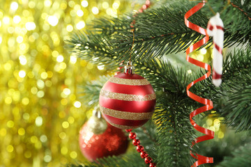 Obraz na płótnie Canvas Christmas baubles on christmas tree on lights background