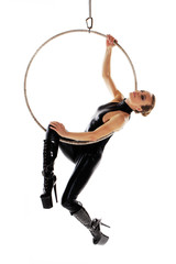 Sexy woman performer in latex catsuit on aerial hoop