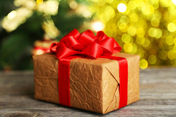 Gift box on grey wooden background