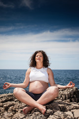 Fototapeta na wymiar pregnant woman practising yoga