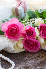 pink and orange roses with lace