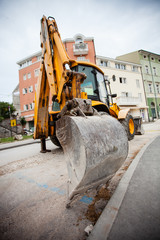 Excavator in a city