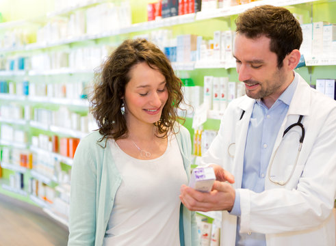 Attractive Pharmacist Advising A Patient