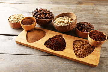 Various of coffee in small dishes on wooden background
