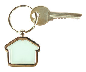 Keys with trinket on light background