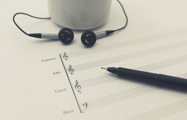 music sheet earphone and cup