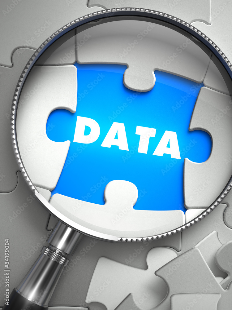 Poster data - puzzle with missing piece through loupe.