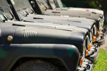 Outdated military jeep standing on conservation - obrazy, fototapety, plakaty