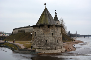 Stone tower and Pskov Kremlin fortress wall at the confluence of two rivers