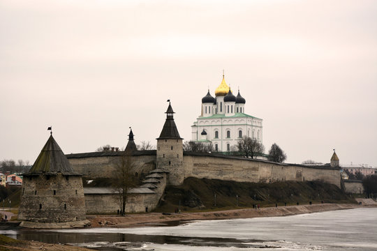 Stone tower and Pskov Kremlin fortress wall at the confluence of two rivers