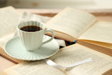 Still life with cup of coffee and books, close up