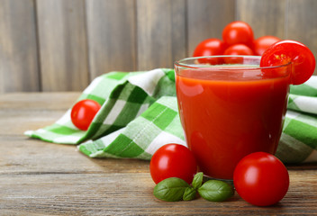 Glasses of tomato juice with vegetables on table close up