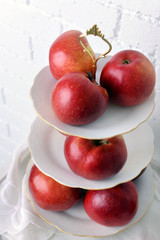 Tasty ripe apples on serving tray close up