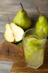Pear juice with fresh fruits on table close up
