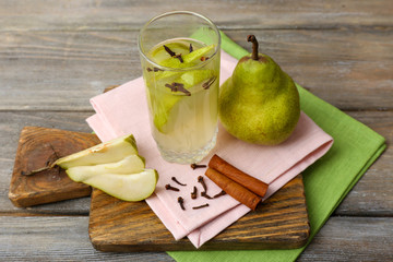 Pear juice with fresh fruits on table close up