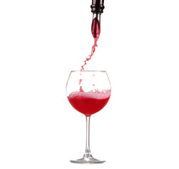 red wine pouring into wine glass isolated