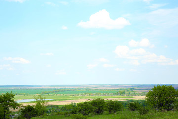 Fototapeta na wymiar Beautiful view of countryside over blue sky background