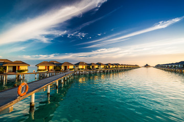 Fototapeta premium Sunset time on island of Maldives over the bridge connecting bun