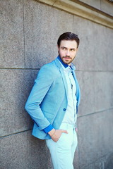 Obraz premium handsome stylish man in casual suit hipster cloth in the street