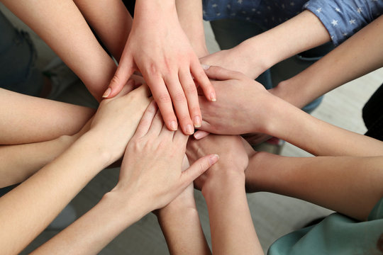 Group of female hands together, closeup
