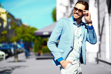 handsome stylish man in casual suit hipster cloth in the street
