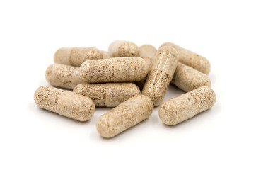 Herb capsules isolated on white background (Medical)