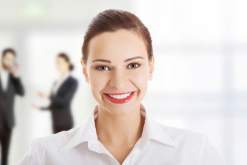Young cheerful smiling business woman.