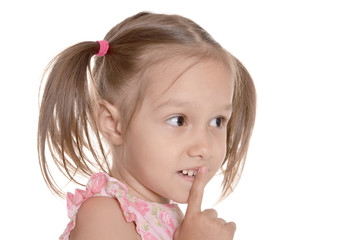 Little girl showing hush sign