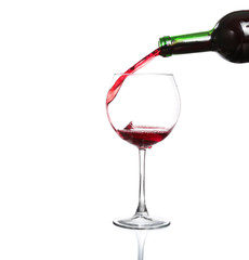 Splash red wine glass against a white background