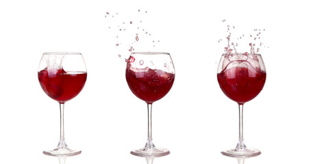 Wine collection - Splashing red wine in a glass. Isolated on whi