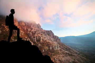 Follow your dreams, silhouette of man at sunset