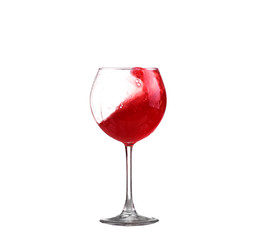 red wine splashing in a glass, isolated on white
