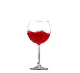 red wine splashing in a glass, isolated on white