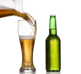 Isolated Glass and Brown bottle of beer on a white background