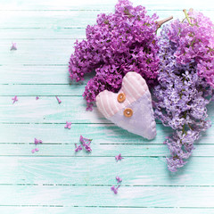 Background with  lilac flowers and decorative heart