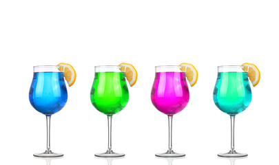 Set of beautiful shot glasses filled with colored alcoholic cocktails