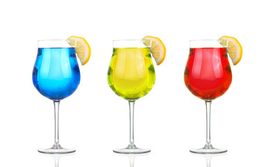Set of beautiful shot glasses filled with colored alcoholic cocktails