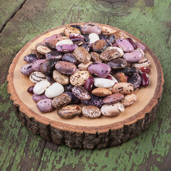 Beans seeds on a wooden plate