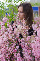 portrait of young beautiful girl in flowers