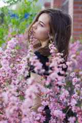 portrait of young beautiful girl in flowers