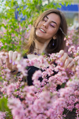 portrait of young beautiful girl in flowers