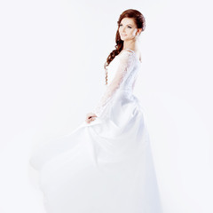 Fototapeta na wymiar Beautiful bride in wedding dress, white background, square