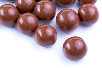 Chocolate candies on a white background.